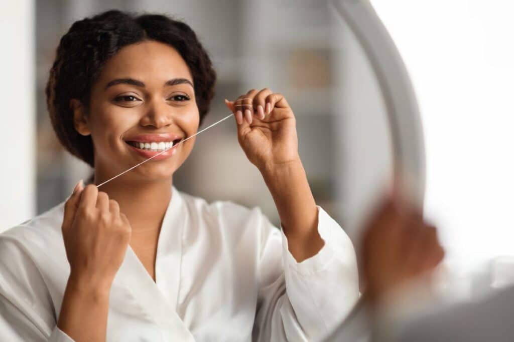flossing with Dental Implants
