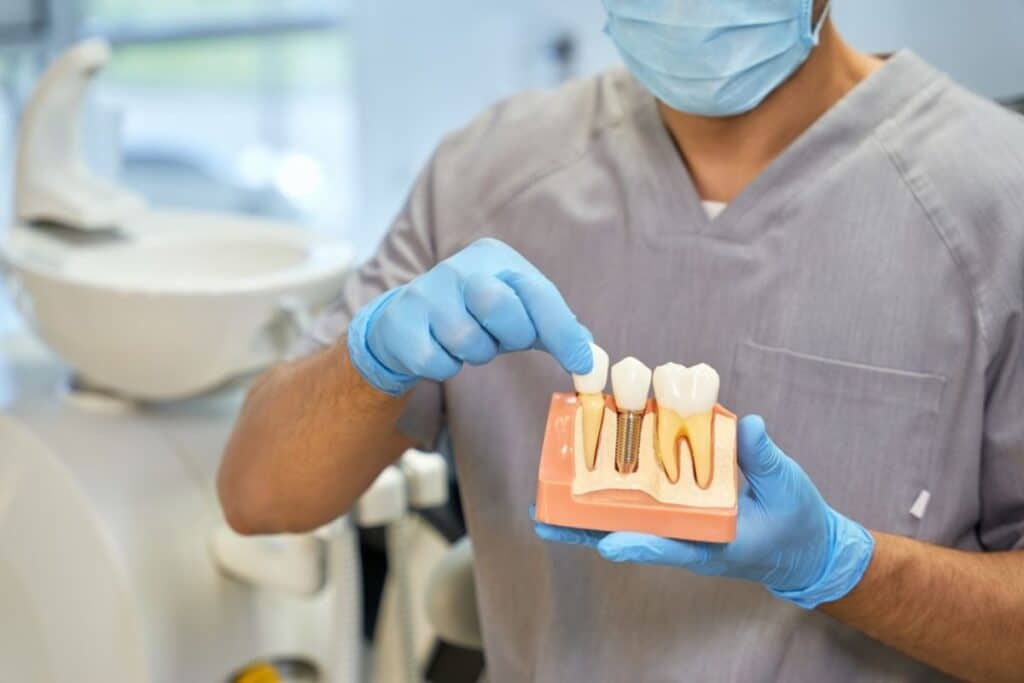 Dental Implants model in Blackwell, Ok being shown by a dentist