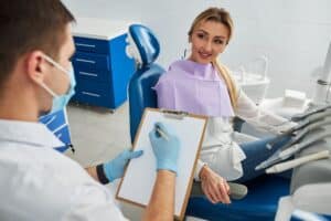 Dentist consulting with patient in dental office at 1520 S Main St, Blackwell, OK.